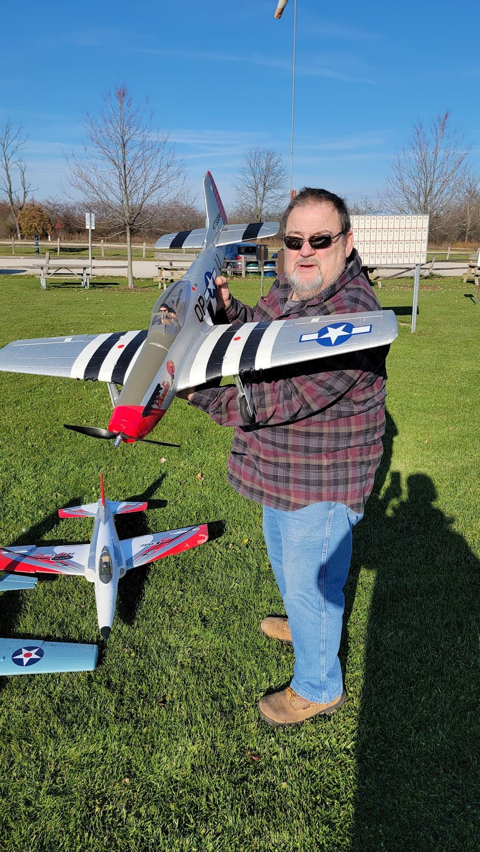 A club member holding a model airplane