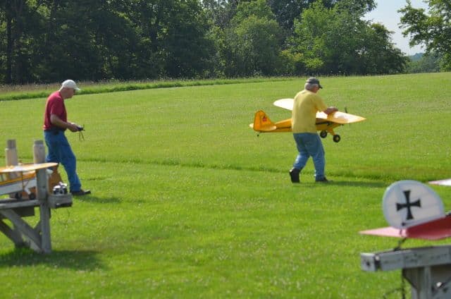 Club members and model aircraft at the field