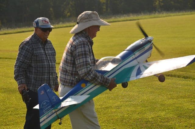 Club members preparing a model airplane