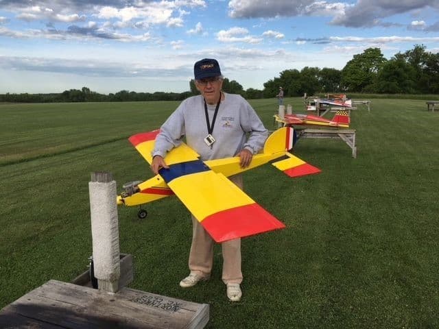 Club member with a yellow model airplane
